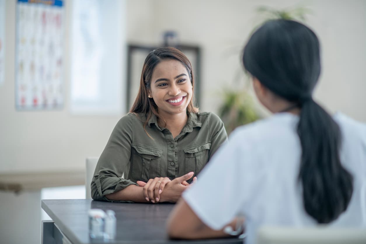 Young woman discussing her health care with a provider