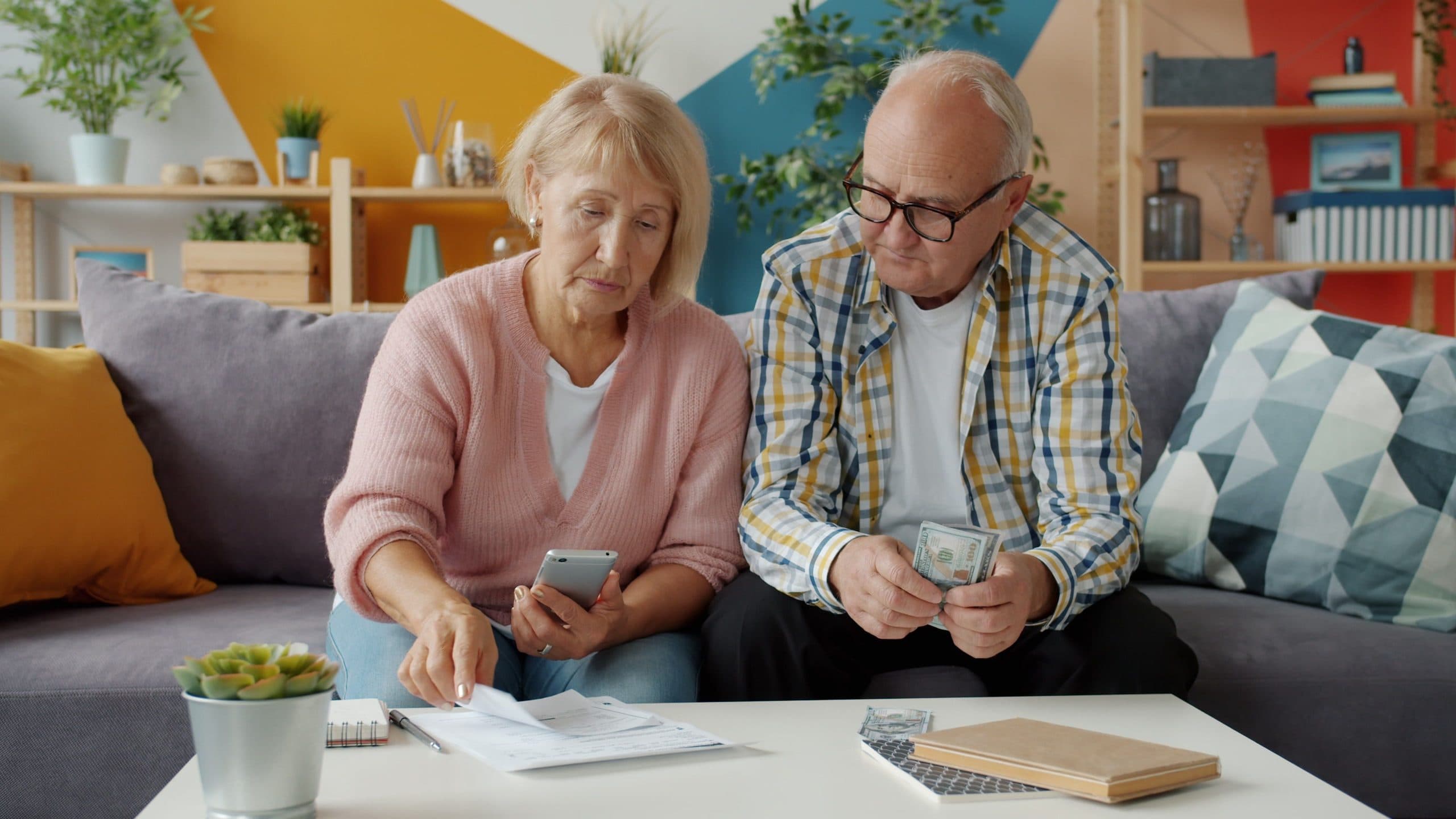 Older couple going over their finances at home