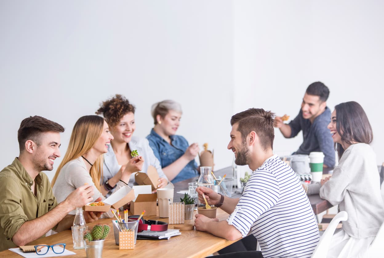 A group of coworkers eating lunch