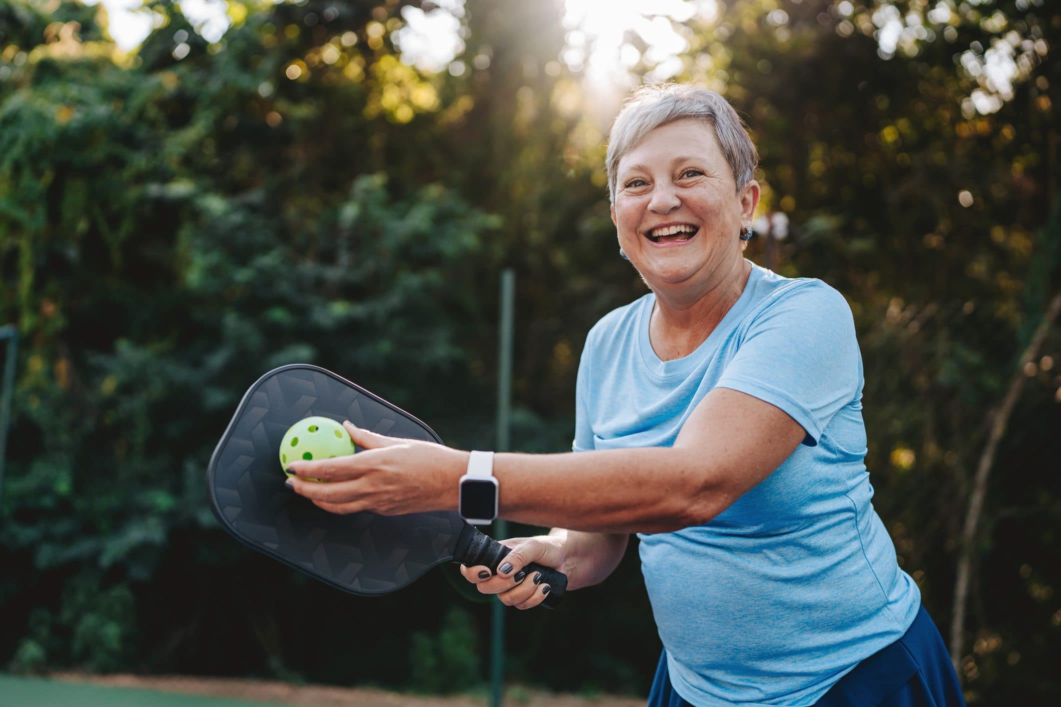 Older woman playing pickleball